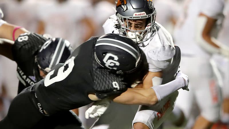 Corner Canyon’s Harrison Taggart brings down Skyridge’s Jeter Fenton during game at Corner Canyon in Draper on Friday, Sept. 24, 2021. Taggart, who signed with Oregon out of high school, recently announced he is transferring to BYU.