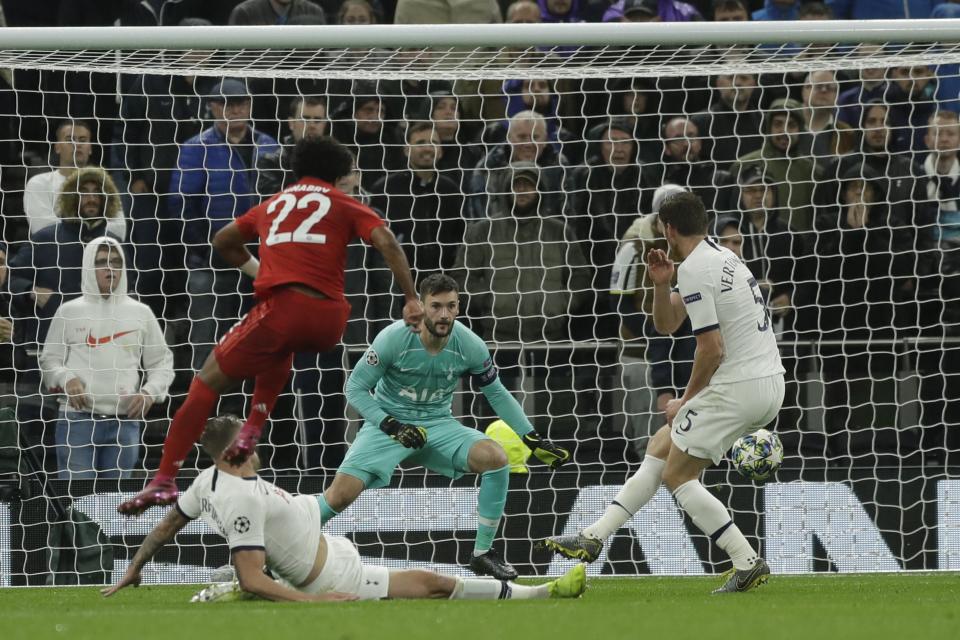 Bayern's Serge Gnabry, left, scores his side's third goal during the Champions League group B soccer match between Tottenham and Bayern Munich at the Tottenham Hotspur stadium in London, Tuesday, Oct. 1, 2019. (AP Photo/Matt Dunham)