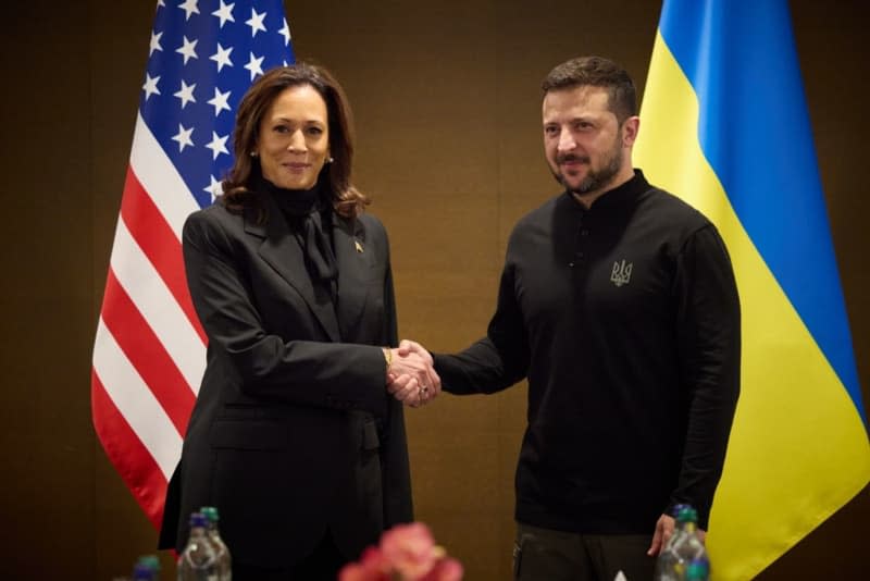 US Vice President Kamala Harris (L) shakes hands with Ukraine's President Volodymyr Zelensky during a meeting on the sideline of a Summit on Peace in Ukraine at the luxury Burgenstock resort. -/Ukraine Presidency/dpa