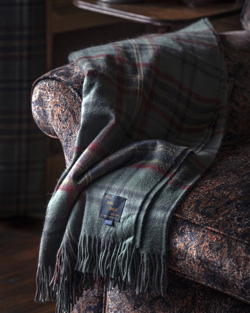 <p><strong>The Fife Arms</strong></p><p><strong>$296.00</strong></p><p><a href="https://shop.thefifearms.com/collections/shop-all-collection/products/the-fife-arms-tartan-blanket" rel="nofollow noopener" target="_blank" data-ylk="slk:Shop Now;elm:context_link;itc:0;sec:content-canvas" class="link ">Shop Now</a></p><p>Speaking of fireside evenings, a cozy blanket is obligatory. This luxe option, available in wool or cashmere, comes courtesy of the buzzy, artsy, historic <a href="https://thefifearms.com/" rel="nofollow noopener" target="_blank" data-ylk="slk:Fife Arms;elm:context_link;itc:0;sec:content-canvas" class="link ">Fife Arms</a>, Scotland's <a href="https://www.townandcountrymag.com/leisure/travel-guide/a30900127/fife-arms-scotland-review/" rel="nofollow noopener" target="_blank" data-ylk="slk:most Instagrammable hotel;elm:context_link;itc:0;sec:content-canvas" class="link ">most Instagrammable hotel</a>. </p>
