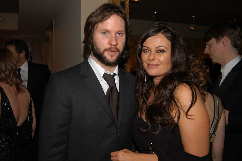 Angela's youngest son, Lawrence, is seen with his wife, Polly