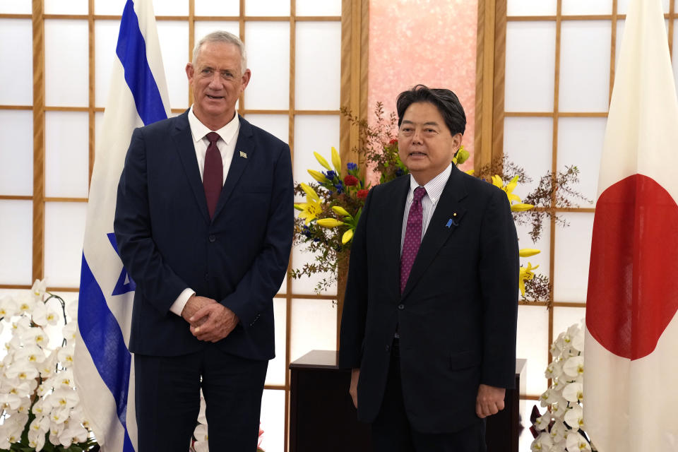 Israeli Defense Minister Benny Gantz, left, and Japan's Foreign Minister Yoshimasa Hayashi pose for a photo before their bilateral meeting at the Foreign Ministry in Tokyo, Tuesday, Aug. 30, 2022. (AP Photo/Shuji Kajiyama)