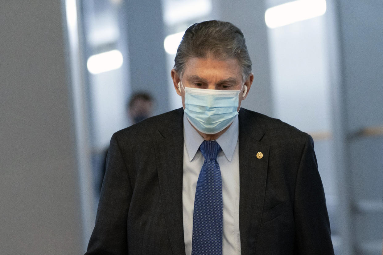 Sen. Joe Manchin, D-W.Va., walks to a vote in the Senate Chamber, Wednesday, Dec. 15, 2021, in Washington. (AP Photo/Jacquelyn Martin)