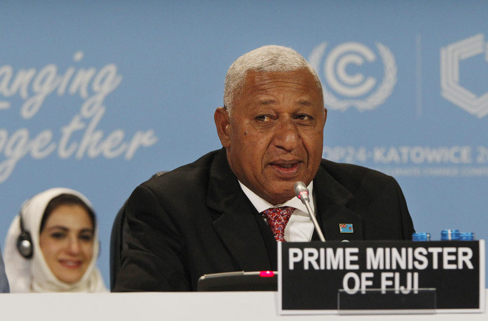 FILE - In this Dec. 3, 2018, file photo, Fiji's Prime Minister Frank Bainimarama addresses representatives of almost 200 nations during a ceremonial opening of the key U.N. climate conference COP24 that is to agree on ways of fighting global warming, in Katowice, Poland. Only four Pacific islands, including Fiji, will be represented by their leaders and most will be forced to send smaller teams in at the forthcoming U.N. climate talks, known as COP26, in Glasgow because of COVID-19 travel restrictions. (AP Photo/Czarek Sokolowski, File)