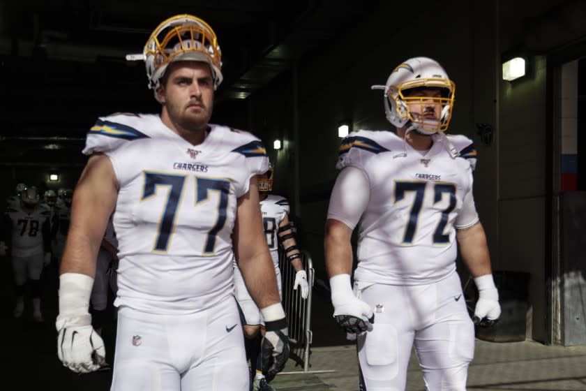 NASHVILLE, TN, SUNDAY, OCTOBER 20, 2019 - Los Angeles Chargers offensive guard Forrest Lamp (77) and Ryan Groy, 72, was to take the field against the Titans at Nissan Stadium. (Robert Gauthier/Los Angeles Times)