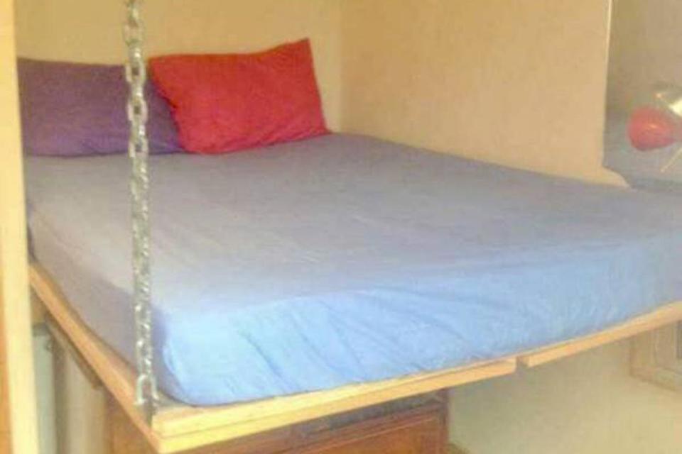 Chains: The bed is suspended mid-air with a chest of drawers underneath: SpareRoom