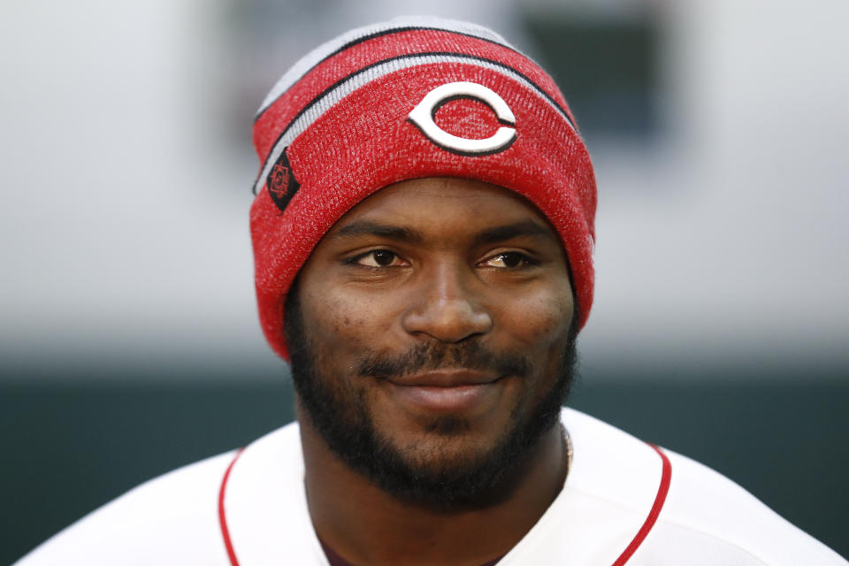 Cincinnati Reds Yasiel Puig takes questions from reporters during a media availability at the P&G MLB Cincinnati Reds Youth Academy, Wednesday, Jan. 30, 2019, in Cincinnati. (AP Photo/John Minchillo)