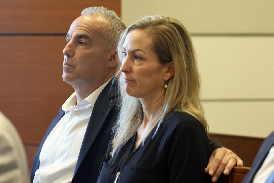 Andrew Pollack sits with his wife, Julie Phillips Pollack, during a hearing at the Broward County Courthouse in Fort Lauderdale, Fla., Monday, Dec. 18, 2023. Andrew Pollack's daughter, Meadow, was killed in the 2018 shootings at Marjory Stoneman Douglas High School. (Amy Beth Bennett/South Florida Sun-Sentinel via AP, Pool)