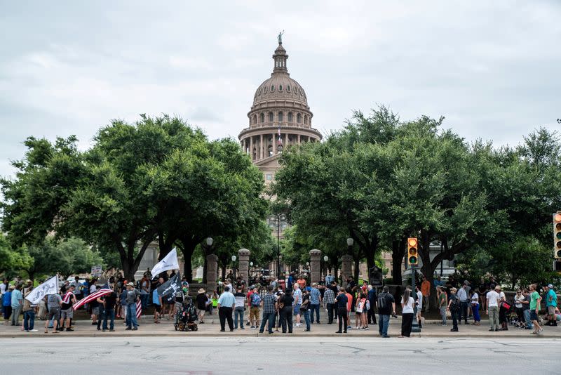 FILE PHOTO: People protest mask mandates in Austin, Texas