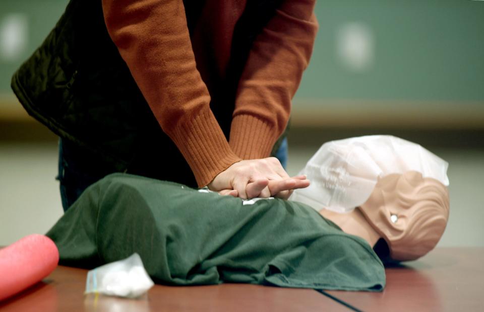 A student does chest compressions at a lifesaving class taught by Randy Feesler, who's known as The Pulse Provider. The class was held at the American Red Cross offices in Canton.