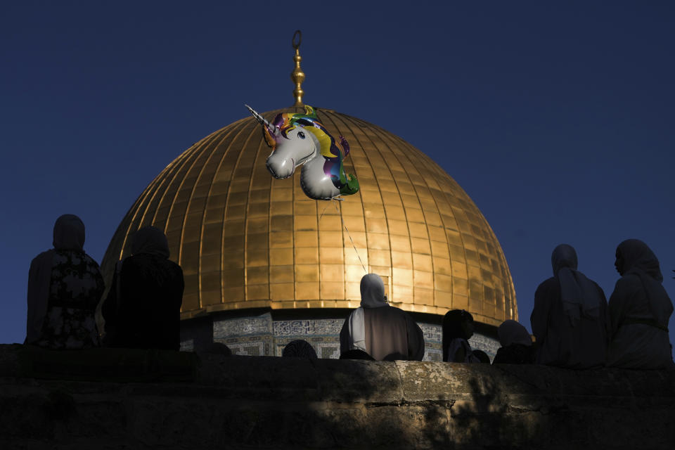 Muslim worshipers gather for Eid al-Adha prayers next to the Dome of the Rock shrine at the Al Aqsa Mosque compound in Jerusalem's Old City, Wednesday, June 28, 2023. Muslims celebrate the holiday to mark the willingness of the Prophet Ibrahim (Abraham to Christians and Jews) to sacrifice his son. During the holiday, they slaughter sheep or cattle, distribute part of the meat to the poor and eat the rest. (AP Photo/Mahmoud Illean)