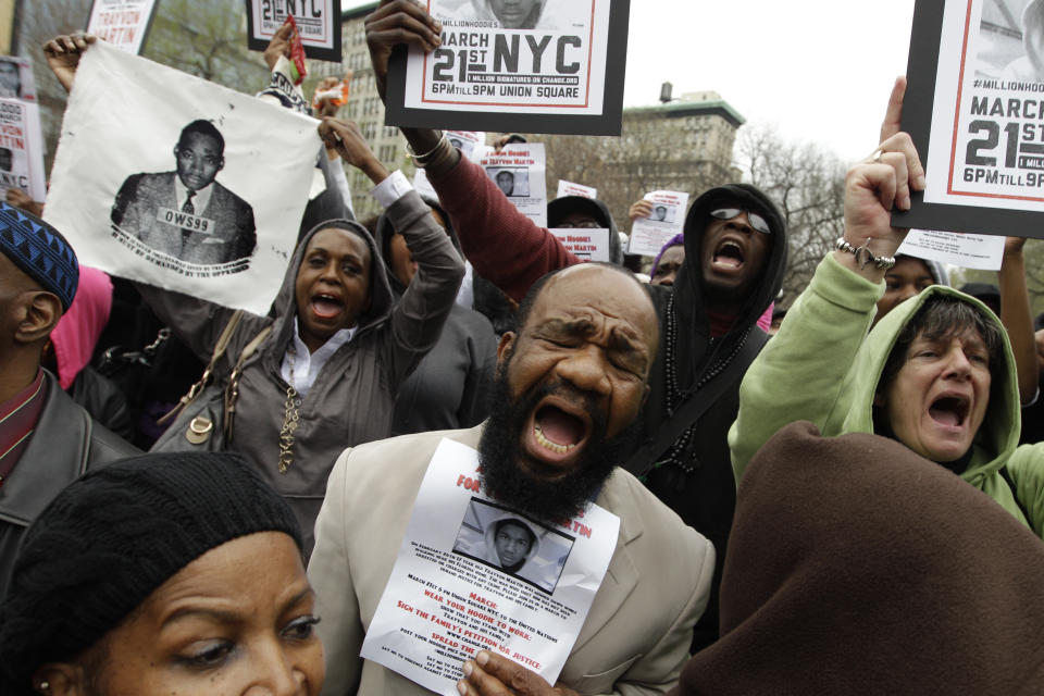 FILE - In this March 21, 2012, file photo, demonstrators chant Trayvon Martin's name during the Million Hoodie March in Union Square in New York. The Feb. 23, 2020, shooting of Ahmaud Arbery has been compared to the 2012 case of Trayvon Martin, the unarmed black Florida teenager shot and killed by a neighborhood watch volunteer. (AP Photo/Mary Altaffer, File)
