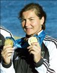 German kayaker Birgit Fischer show her two gold medals to photographers at the end of medals ceremony of the women's K2, 500 meters final, on Penrith Lake, west of Sydney, 01 October 2000, at the Sydney Olympic games. Birgit Fischer won 10 medals, 7 of them gold since Moscow Olympic Games (1980), 20 years of competition. AFP PHOTO/ THOMAS COEX