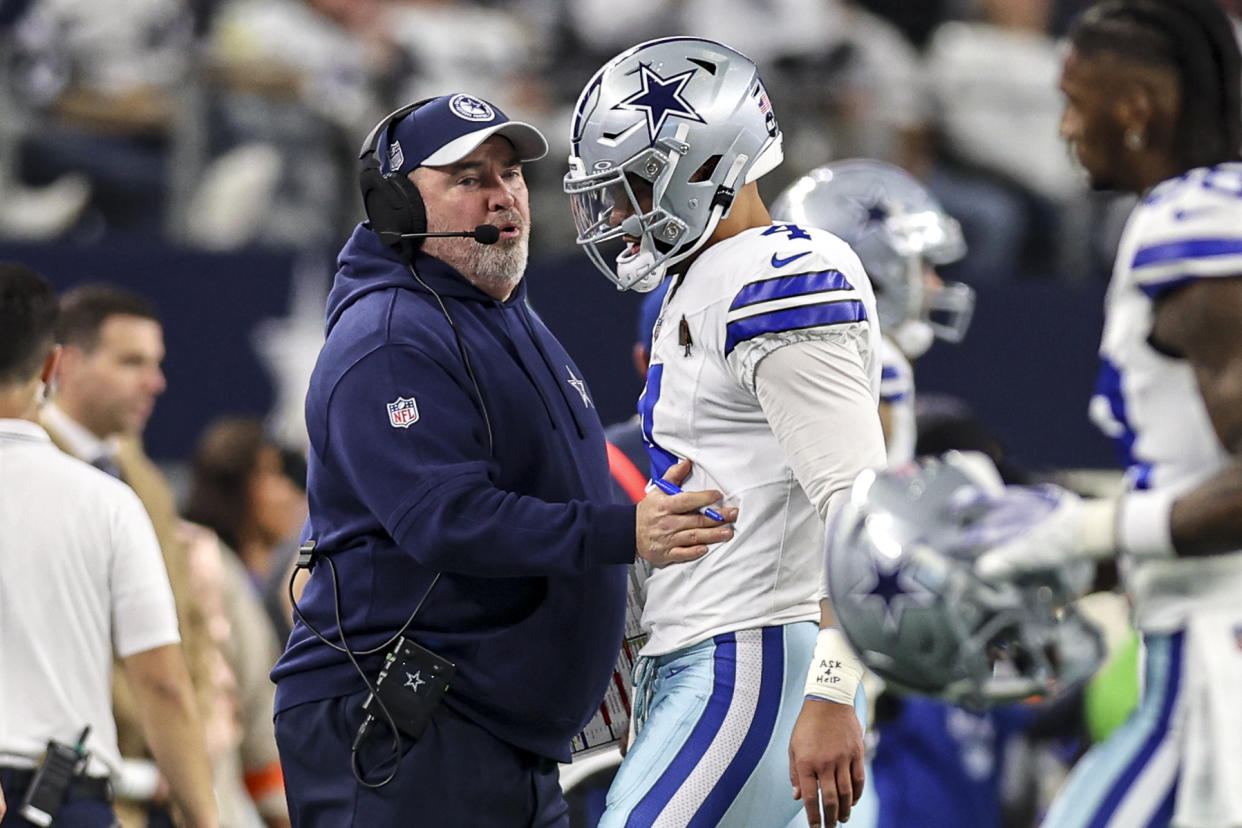 ARLINGTON, TX - JANUARY 14: Dallas Cowboys head coach Mike McCarthy talks to quarterback Dak Prescott (4) after an interception during the NFC Wild Card game between the Dallas Cowboys and the Green Bay Packers on January 14, 2024 at AT&T Stadium in Arlington, Texas. (Photo by Matthew Pearce/Icon Sportswire via Getty Images)