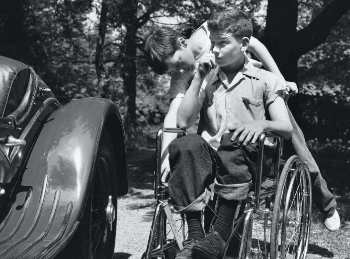 For much of the 20th century, Americans were used to seeing people bearing the signs of past polio infection. <a href="https://www.gettyimages.com/detail/news-photo/boy-helps-his-brother-a-polio-victim-confined-to-a-news-photo/526756448" rel="nofollow noopener" target="_blank" data-ylk="slk:Genevieve Naylor/Corbis via Getty Images;elm:context_link;itc:0" class="link ">Genevieve Naylor/Corbis via Getty Images</a>