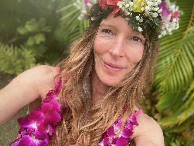 Ingrid Kaat takes a photo on the first day of her retirement in Hawaii after a 25-year service.