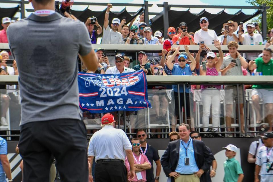 Fans cheer as former President Donald Trump arrives in July at the first-tee box during the final round of an LIV Golf tournament at Trump National Golf Club in Bedminster, New Jersey. John Jones/USA TODAY Sports