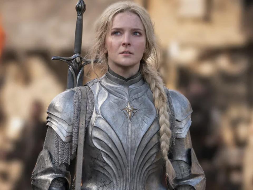 A woman with a blonde braid in armour.