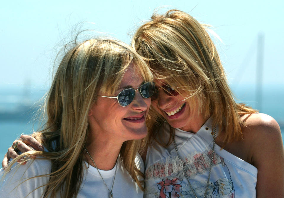 Patricia (L) and Rosanna Arquette pose for photographers, in Cannes May 16, 2002. Rosanna Arquette and her sister Patricia are in Cannes to promote Rosanna's movie "Searching for Debra Winger".