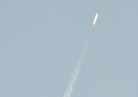 A flying object soars into the air above North Korean territory as seen from the Chinese border city of Dandong, in this photo taken by Kyodo February 7, 2016. REUTERS/Kyodo