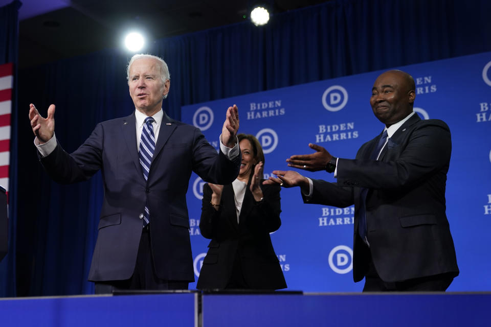 President Joe Biden and Vice President Kamala Harris stand on stage with DNC chair Jaime Harrison at the Democratic National Committee winter meeting, Friday, Feb. 3, 2023, in Philadelphia. (AP Photo/Patrick Semansky)