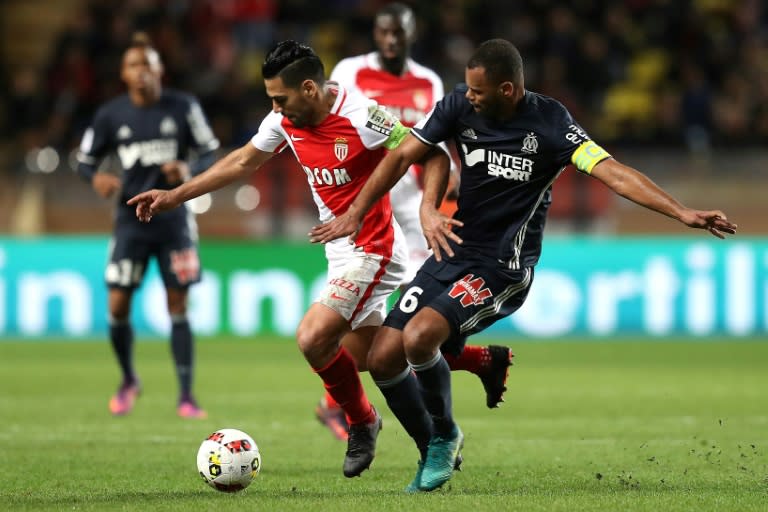 Monaco's forward Radamel Falcao (L) challenges Marseille's defender Jorge Pires Da Fonseca Rolando (R) during the French L1 football match November 26, 2016