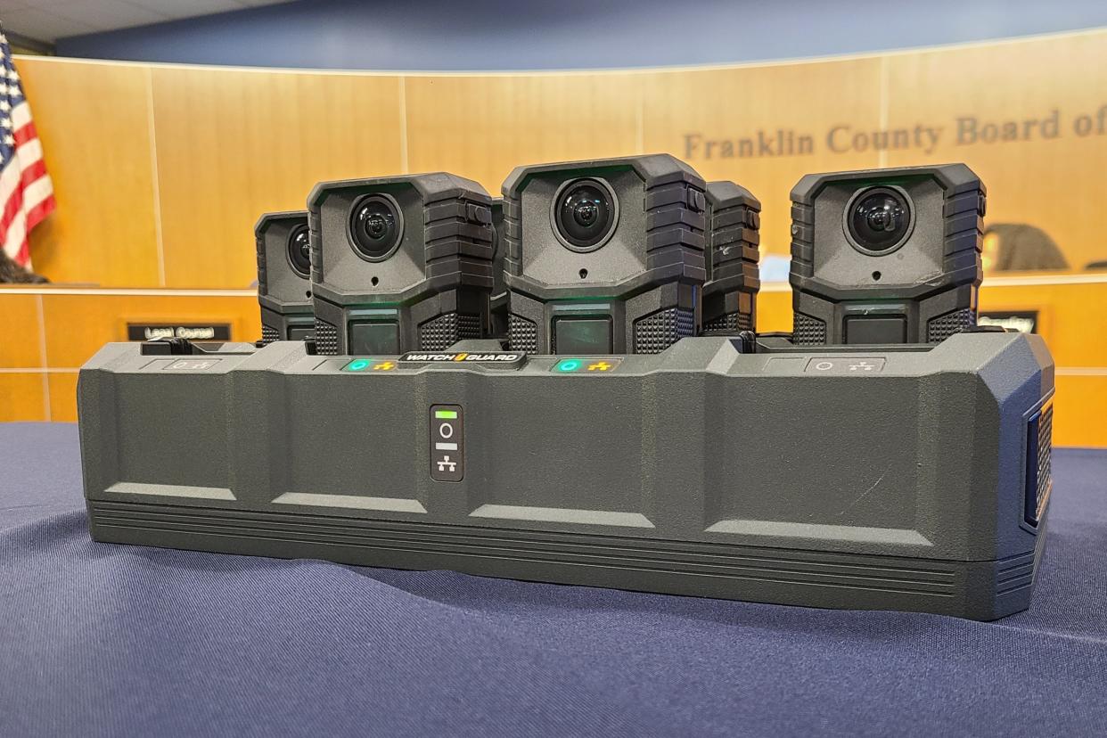 New Motorola WatchGuard body cameras like those that will be used by Franklin County Sheriff's deputies shown resting in a docking station.