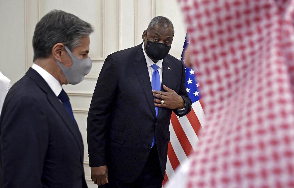 US Secretary of State Antony Blinken, foreground and Secretary of Defense Lloyd Austin, arrive for a joint press conference, at the Ministry of Foreign Affairs in Doha, Qatar, Tuesday, Sept. 7, 2021. (Olivier Douliery/Pool Photo via AP)