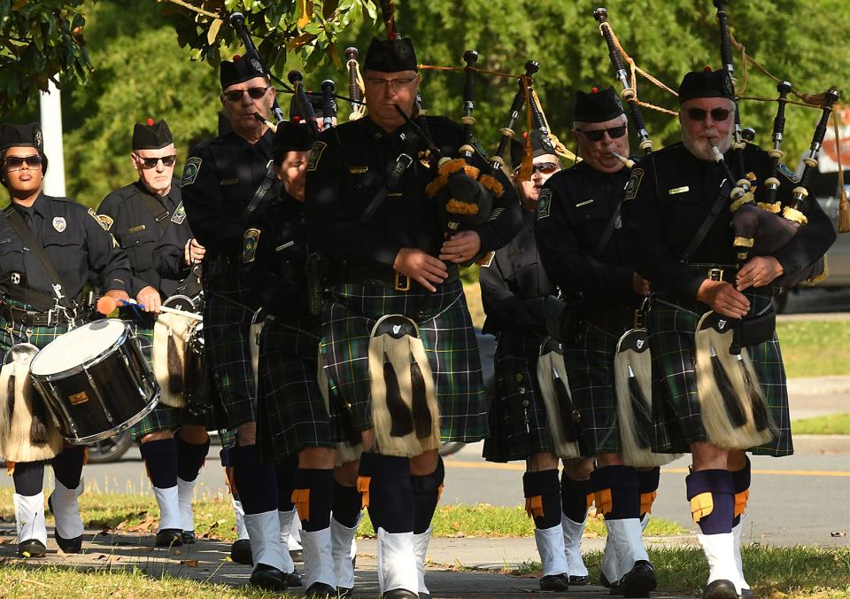 Members of the Wilmington Police Pipes and Drums play during the 2022 Wilmington Area Law Enforcement Memorial Thursday May 5, 2022 in front of the WPD headquarters. The ceremony took place in honor of annual Peace Officers Day, a nationwide event honoring those who gave their lives in the line of duty.  [KEN BLEVINS/STARNEWS]    