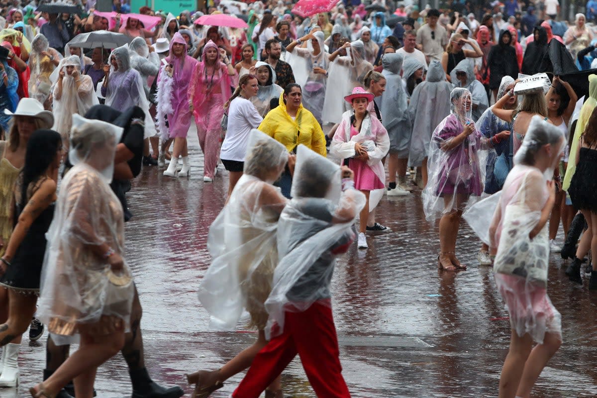 Swifties braving the wild weather in Sydney on their way to the Accor Stadium (Getty Images)