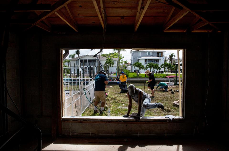 Volunteers descended on Joe Salvaggio's Fort Myers Beach home on Sunday, Aug. 20, 202,3 to help clean it up. Salvaggio, 84, survived Hurricane Ian in the attic of his home. After hearing a media report involving a dispute with his contractor for work not getting done, volunteers stepped in and are helping him get the necessary repairs done on his home.