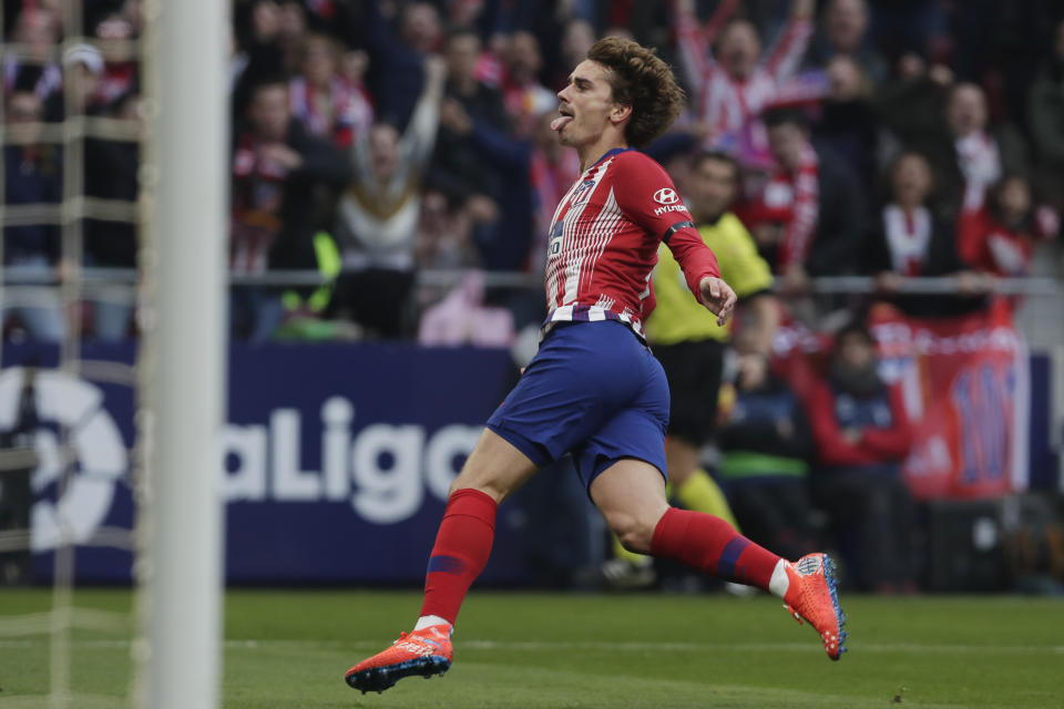 Atletico Madrid's Antoine Griezmann celebrates after scoring his sides 1st goal during a Spanish La Liga soccer match between Atletico Madrid and Real Madrid at the Metropolitano stadium in Madrid, Spain, Saturday, Feb. 9, 2019. (AP Photo/Manu Fernandez)