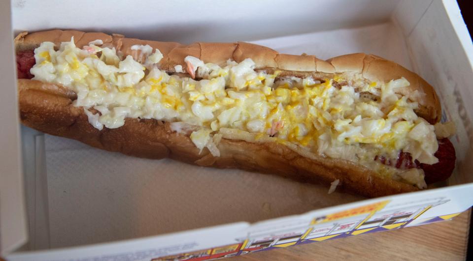 The Jack Pirtle's Chicken menu features a hot dog, pictured here with slaw and mustard, on Wednesday, July 6, at their Poplar Avenue location in Memphis.