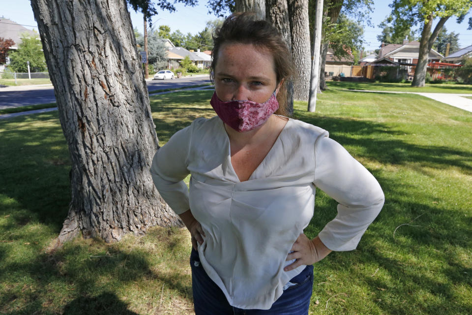 Madalena McNeil poses for photographs Thursday, Aug. 6, 2020, in Salt Lake City. Some Black Lives Matter protesters in Utah could face up to life in prison if they're convicted of splashing red paint and smashing windows during a protest, a potential punishment that stands out among demonstrators arrested around the country and one that critics say doesn't fit the alleged crime. "This is so far beyond just the enforcement of the law, it feels retaliatory," said McNeil, a McNeil, who is facing a potential life sentence over felony criminal mischief and riot charges. (AP Photo/Rick Bowmer)