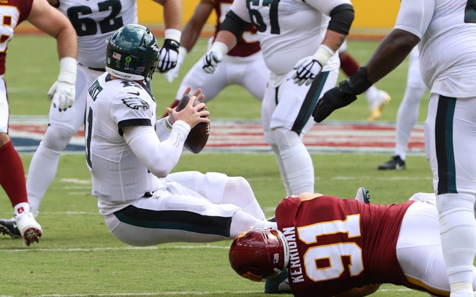 Washington Football Team defensive end Ryan Kerrigan (91) sacks Philadelphia Eagles quarterback Carson Wentz (not pictured) in the second quarter at FedExField.  - Geoff Burke-USA TODAY Sports