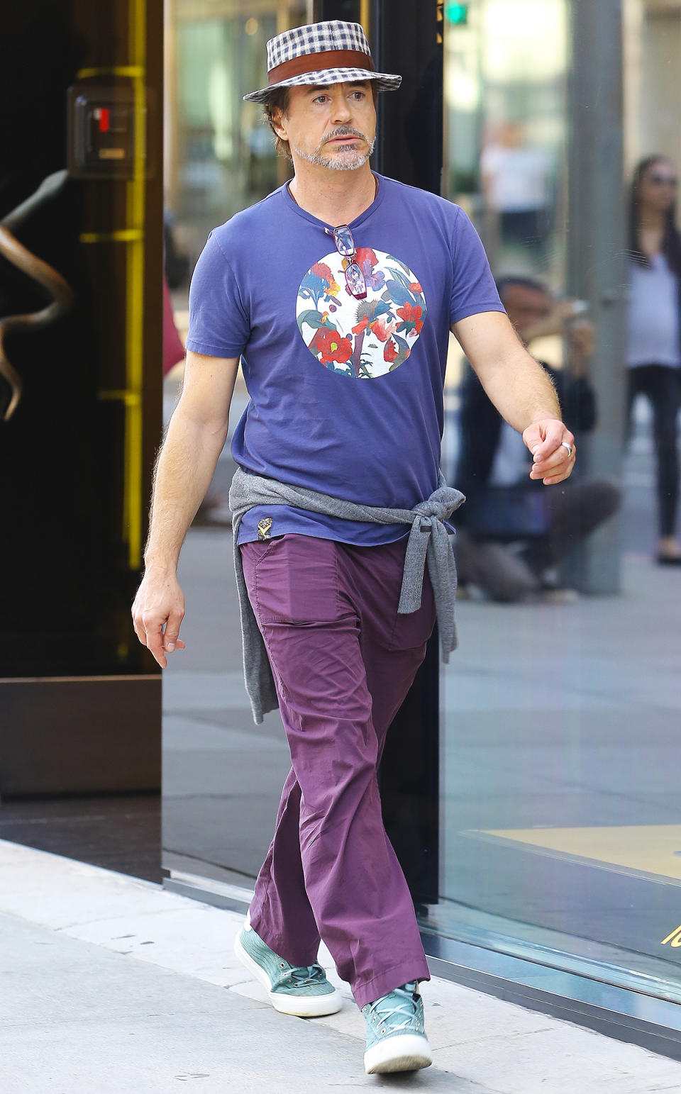 <p>Robert Downey Jr. is bringing Barney chic to the masses, taking a very bold sartorial stance in head-to-toe shades of purple, and adding a jaunty plaid boater just for good measure.</p>