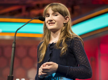 Sylvie Lamontagne of Lakewood, Colorado, struggles as she misspells "cerastes" during the final round of the 88th annual Scripps National Spelling Bee at National Harbor, Maryland May 28, 2015. REUTERS/Joshua Roberts