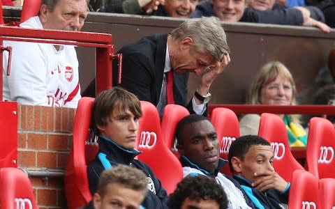 Arsene Wenger in the dugout for Arsenal's 8-2 defeat at Manchester United - Credit: Action Images