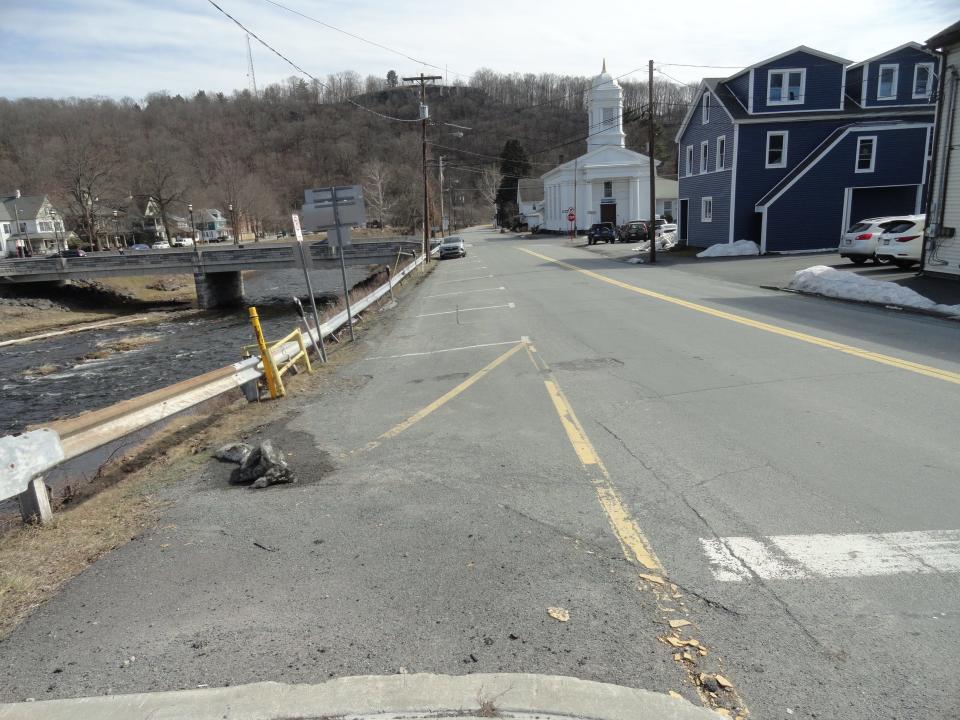 Twelfth Street, Honesdale, Pa., looking towards Church Street from the corner with Main Street, March 22. Irving Cliff may be seen overlooking the Lackawaxen River.