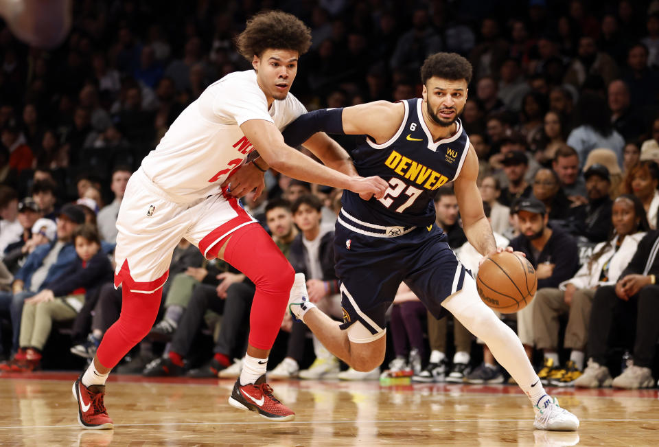 Jamal Murray #27 of the Denver Nuggets dribbles against Cameron Johnson #2 of the Brooklyn Nets during the second half at Barclays Center on March 19, 2023 in the Brooklyn borough of New York City. The Nuggets won 108-102. NOTE TO USER: User expressly acknowledges and agrees that, by downloading and/or using this photograph, User is consenting to the terms and conditions of the Getty Images License Agreement. (Photo by Sarah Stier/Getty Images)