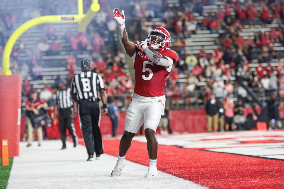 Aug 29, 2024; Piscataway, New Jersey, USA; Rutgers Scarlet Knights running back Kyle Monangai (5) celebrates after a touchdown during the second half against the Howard Bison at SHI Stadium. Mandatory Credit: Vincent Carchietta-USA TODAY Sports