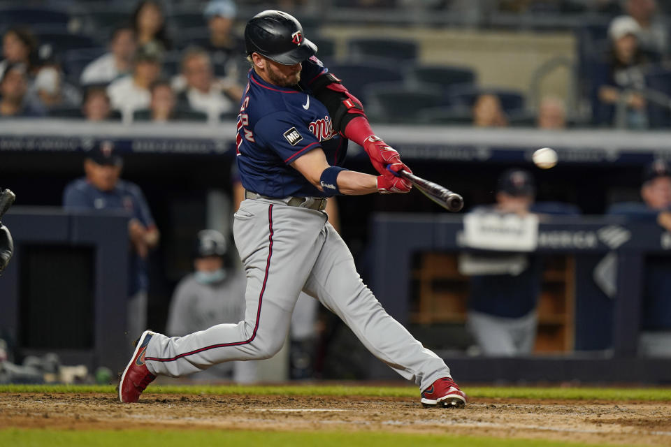 Minnesota Twins' Josh Donaldson hits a two-run home run during the sixth inning of a baseball game against the New York Yankees, Friday, Aug. 20, 2021, in New York. (AP Photo/Frank Franklin II)