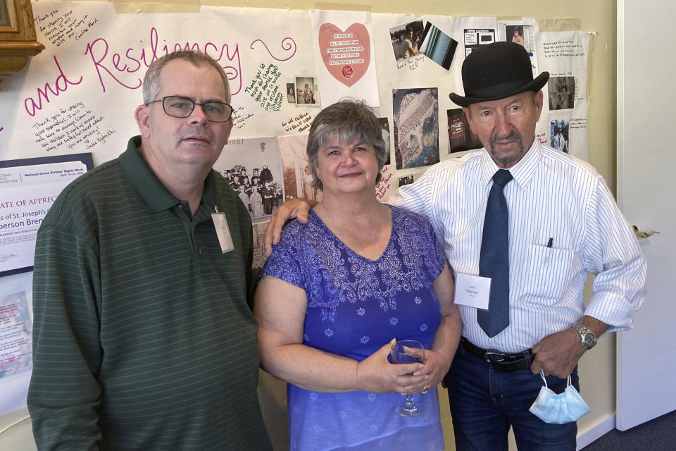 Michael Ryan, of Buckingham, Va., Brenda Hannon, of Williston, Vt. and John Magnago, of Miami, from left to right, pose in South Burlington, Vt., during a reunion of orphans from the St. Joseph's Orphanage in South Burlington, Vt., Thursday, Sept. 16, 2021. Some of the residents of the long-closed Vermont orphanage want the Catholic Church to pay for therapy as they continue to recover from what they felt was the abuse most of which occurred more than half a century ago. (AP Photo/Wilson Ring)