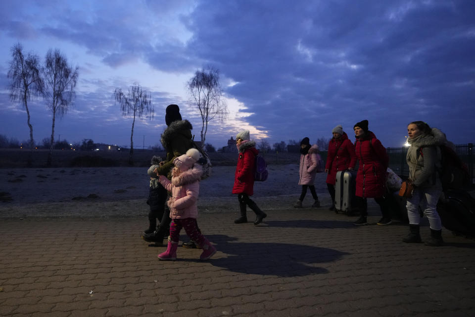 FILE - Refugees fleeing conflict in neighboring Ukraine arrive to in Przemysl, Poland, on Feb. 27, 2022. The U.N. refugee agency says more than 4 million refugees have now fled Ukraine following Russia’s invasion, a new milestone in the largest refugee crisis in Europe since World War II. (AP Photo/Petr David Josek)