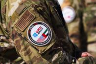 A patch is seen on a U.S. soldier's uniform at the Dubai Air Show in Dubai, United Arab Emirates, Sunday, Nov. 14, 2021. The biennial Dubai Air Show opened Sunday as commercial aviation tries to shake off the coronavirus pandemic. (AP Photo/Jon Gambrell)