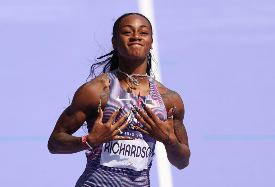 PARIS, FRANCE - AUGUST 02:  Sha'carri Richardson of Team United States celebrates during the Women's 100m Round 1 on day seven of the Olympic Games Paris 2024 at Stade de France on August 02, 2024 in Paris, France. (Photo by Hannah Peters/Getty Images)