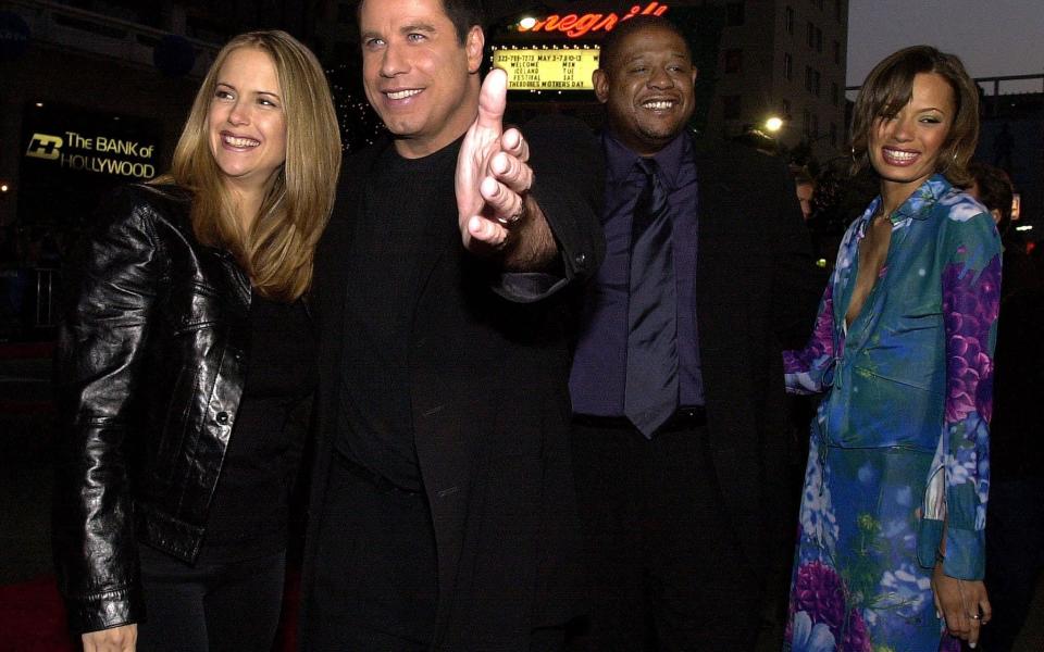 Kelly Preston, John Travolta, Forest Whitaker and his wife Keisha arriving at the Battlefield Earth premiere - AFP