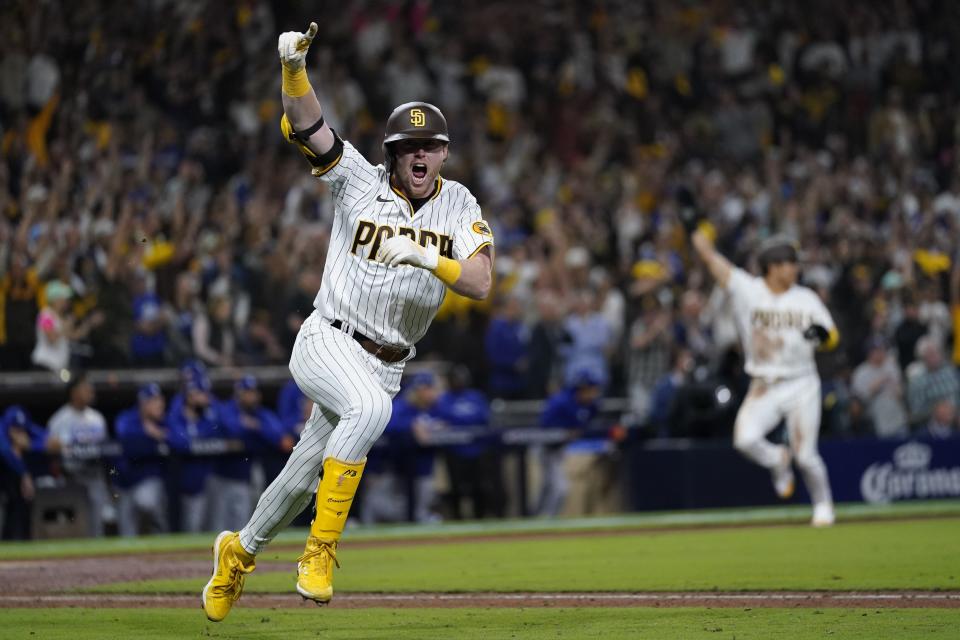 San Diego Padres' Jake Cronenworth reacts after hitting a two-run single during the seventh inning in Game 4 of a baseball NL Division Series against the Los Angeles Dodgers, Saturday, Oct. 15, 2022, in San Diego. (AP Photo/Ashley Landis)