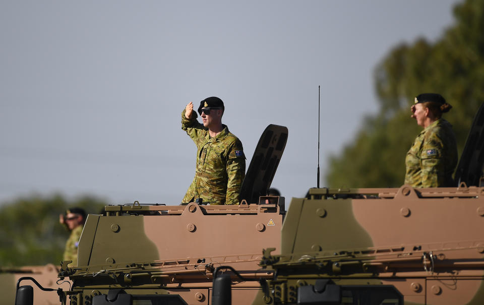 TOWNSVILLE, AUSTRALIA – DECEMBER 01: Soldiers of the 2nd Calvary Regiment salutes during the 2nd Cavalry Regiment Mounted Parade on December 01, 2018 in Townsville, Australia. The parade celebrates the 48th birthday of the 2nd Cavalry Regiment and commemorates the battle of Cambrai. (Photo by Ian Hitchcock/Getty Images)