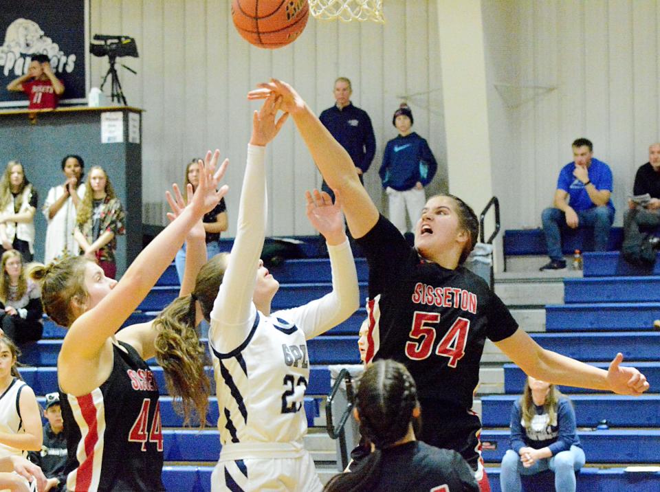 Sisseton's Krista Langager (54) and Chloe Langager (44) defend against Great Plains Lutheran's Esta Cameron during their season-opening high school girls basketball game on Thursday, Dec. 1, 2022 in Watertown.